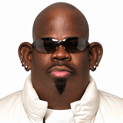Big Mondo, wearing dark glasses and a white jacket
